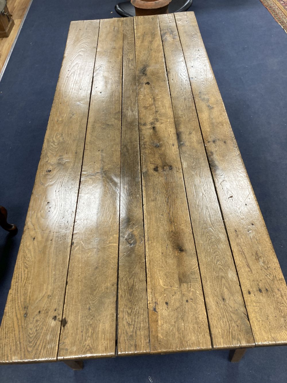 A 19th century French oak and elm farmhouse kitchen table, width 203cm depth 82cm height 73cm